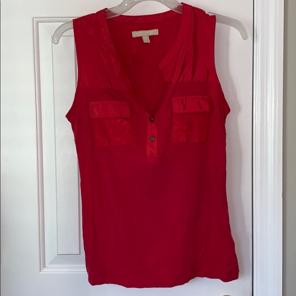 Sleeveless coral top with gold buttons